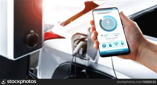 EV charging station for electric car with mobile app display charger status . The electric power is produced from sustainable resources to supply to charger station in order to reduce CO2 emission .. EV charging station for electric car with mobile app display charger status