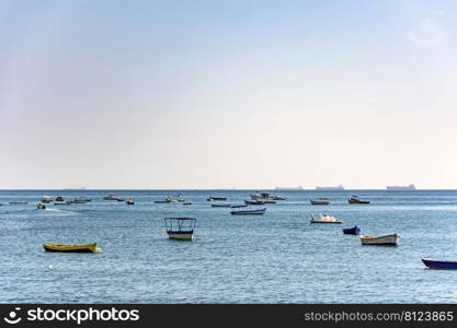 Evening at Todos os Santos bay in Salvador Bahia during a sunny summer day with its moored boats and the skyline. Evening at Todos os Santos bay in Salvador Bahia during a sunny summer day