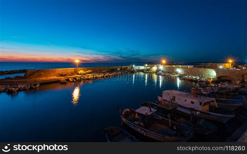 Evening dusk in Gallipoli, province of Lecce, Puglia, southern Italy. View from walls of Angevine-Aragonese medieval Castle fortress. Evening Gallipoli Castle, Puglia, Italy