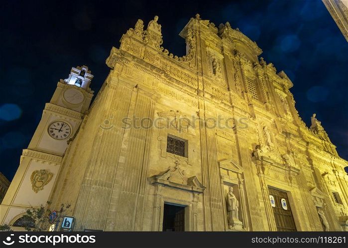 Evening dusk in Gallipoli, province of Lecce, Puglia, southern Italy. Baroque facade of the Saint Agata Cathedral. Some lens flares from lamp available.. Evening Gallipoli, Puglia, Italy, Saint Agata Cathedral.