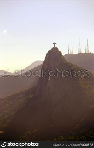 evening hills with statue of Jesus at Rio de Janeiro abstract shot at sunset time, Brazil