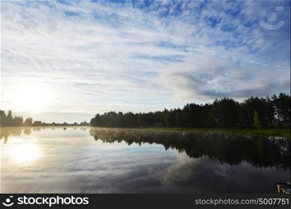 evening landscape. blue sky, clouds and water