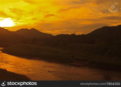 evening landscape mountain with sunset on river