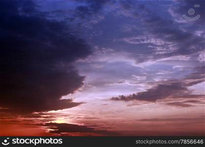 Evening landscape with beautiful pale picturesque clouds
