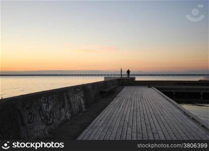 Evening light at a wooden pier by the harbor