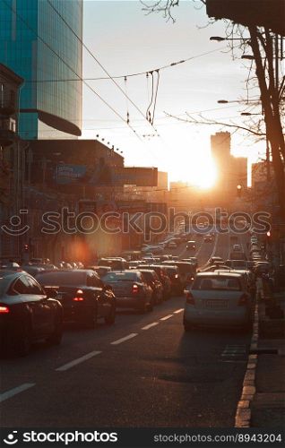 Evening rush hour cityscape photo. Cars on roadway. Beautiful urban sce≠ry photography with blurred background. Street sce≠. High qualityπcture for wallpaper, travel blog, magazi≠, artic≤. Evening rush hour cityscape photo
