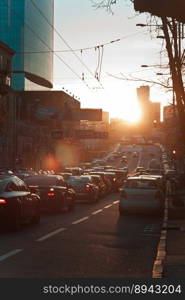 Evening rush hour cityscape photo. Cars on roadway. Beautiful urban sce≠ry photography with blurred background. Street sce≠. High qualityπcture for wallpaper, travel blog, magazi≠, artic≤. Evening rush hour cityscape photo