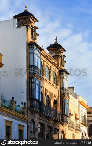 Evening Seville city cityscape (houses on sky background), Andalusia, Spain.