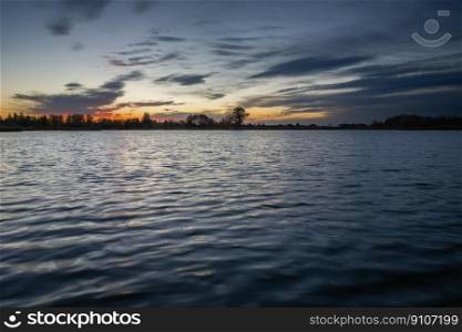 Evening sky and clouds over a calm lake, Stankow, Poland