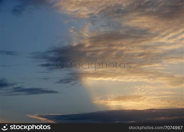 Evening sky with clouds and sunny rays. Sunset of sun. Sunset with sun rays. Beautiful blazing sunset landscape. Evening sky with clouds and sunny rays. Sunset of sun