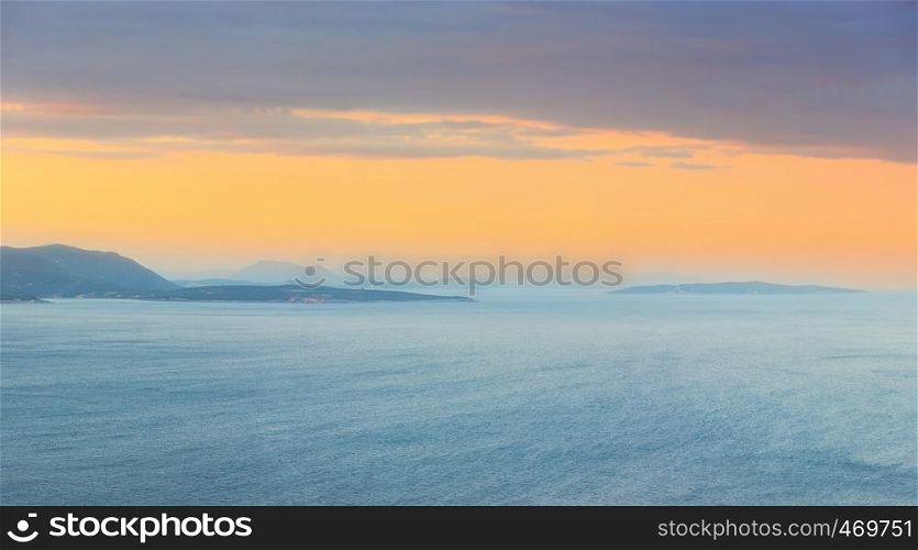 Evening South cape of Lefkas island shore panorama in pastel illumination, Lefkada, Greece, Ionian Sea