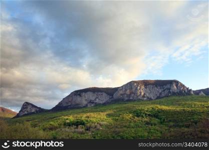 "Evening spring mountain massif landscape (rock "Sokolinuj Vzljot" (Falcon Flying up), near Sokolinoe village, Crimea, Ukraine)"
