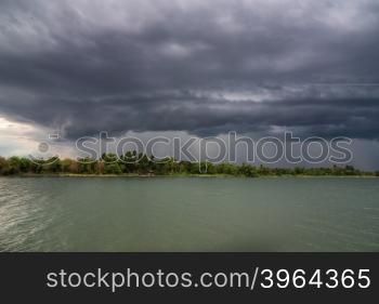 Evening storm over watershed and dramatic sky and clouds