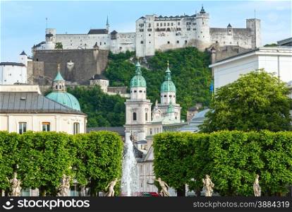 Evening summer Salzburg City view and Hohensalzburg Fortress (built in 1077) on mountain top (Austria)