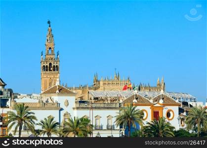 Evening summer Seville city view and Giralda bell tower, Spain. Constructed in 1184-1198.