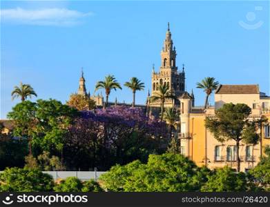 Evening summer Seville city view and Giralda bell tower, Spain. Constructed in 1184-1198.