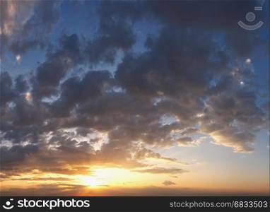 Evening sunset sky with clouds. Two shots composite panorama good for sky background.
