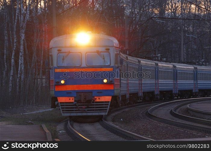 evening train rides on the railroad among the forest