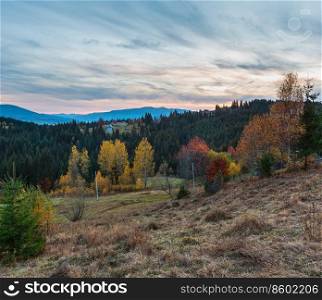 Evening twilight Carpathian mountains and village hamlets on slopes  Yablunytsia village and pass, Ivano-Frankivsk oblast, Ukraine .