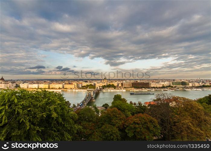 Evening view of river danube and chain bridge, Budapest, Hungary, landscape, clouds in sky, wide angle, copyspace at top.