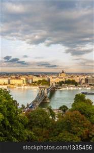 Evening view of river danube and chain bridge, Budapest, Hungary, portrait, clouds in sky, wide angle.