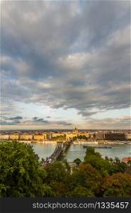 Evening view of river danube and chain bridge, Budapest, Hungary, portrait, clouds in sky, wide angle, copyspace at top.