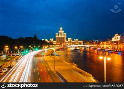 Evening view of the Moscow City. Beautiful cityscape view of Moscow city during sunset with car light trails and Moscow-river. Panoramic view of Moscow landmark during sunset from Zaryadye Park