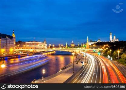 Evening view of the Moscow City from Zaryadye Park. Beautiful cityscape view of Moscow city during sunset with car light trails and Moscow-river. Panoramic view of Moscow landmark during sunset from Zaryadye Park