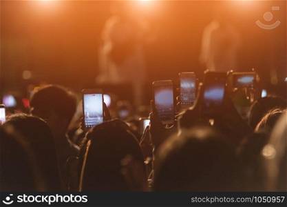 Event people live video festival music concert by hand holding smart mobile phone