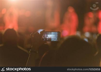 Event people live video festival music concert by hand holding smart mobile phone