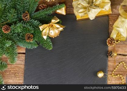 evergreen tree with golden decorations . evergreen fir tree with golden decorations christmas frame on black background