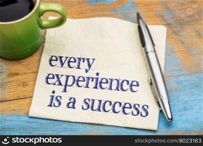 Every experience is a success - handwriting on a napkin with a cup of coffee