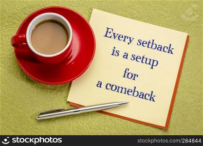 Every setback is a setup for a comeback - handwriting on a square note with a cup of coffee and pen