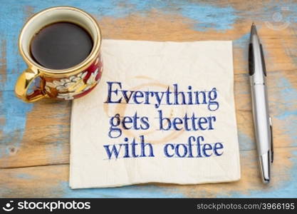 Everything gets better with coffee - handwriting on a napkin with a cup of coffee