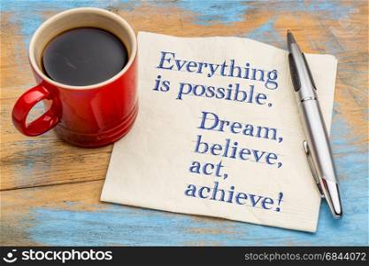 Everything is possible. Dream, believe, act, achieve! A handwriting on a napkin with a cup of coffee