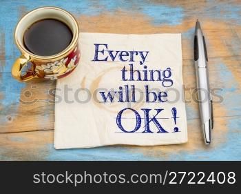 Everything will be OK! Handwriting on a napkin with a cup of coffee and pen.