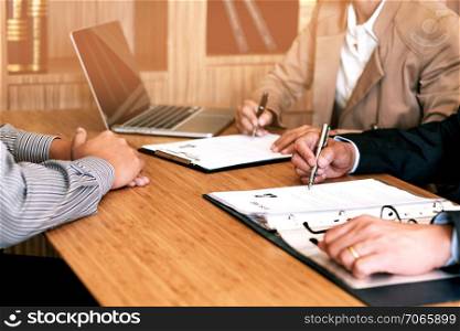 Examiner reading a resume during job interview at office Business and human resources concept.