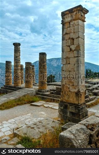 Excavations of the ancient Delphi city along the slope of Mount Parnassus(Greece). The remaining columns of the Temple of Apollo.