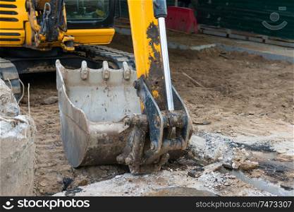 Excavator bucket or scoop at construction site, macro shot