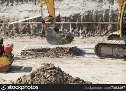Excavator digger on a building site. Earthwork.