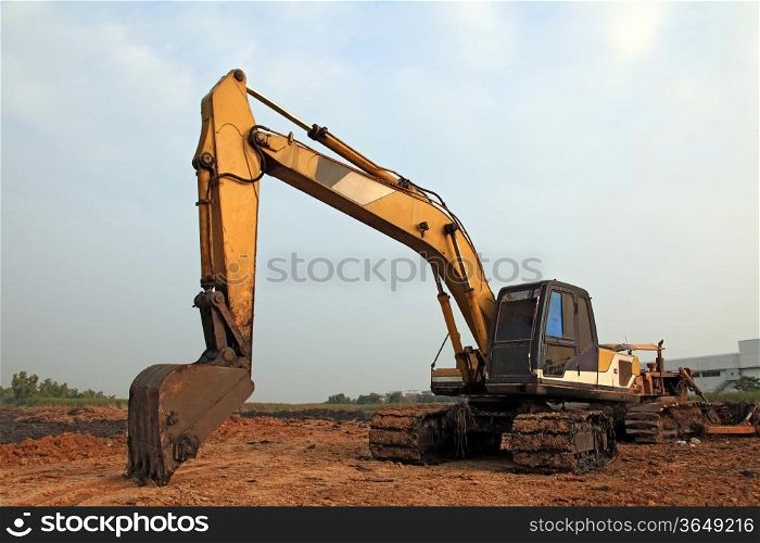 Excavator Loader with backhoe standing in sandpit