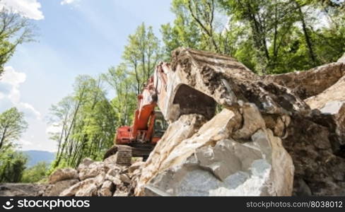 Excavator with big shovel to work with rocks