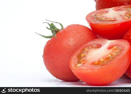 Excellent close up of fresh ripe vine tomatoes with dew drops isolated on white background