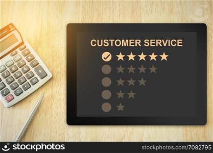 excellent five stars customer service on tablet with soft light vintage effect