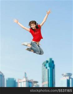 excercise and fitness concept - happy girl jumping in the air
