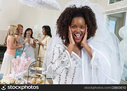 Excited bride wearing veil at bridal shower