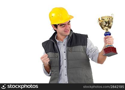 Excited builder holding trophy