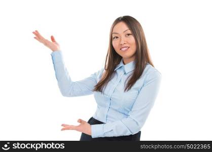 Excited business woman pointing at your product against white background