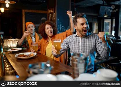 Excited football fans in the pub. Guys drinking craft beer and watching football game. Diverse young people group rest in sports bar. Excited football fans in the pub
