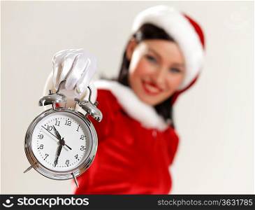 excited girl with santa hat holding clock. illustration